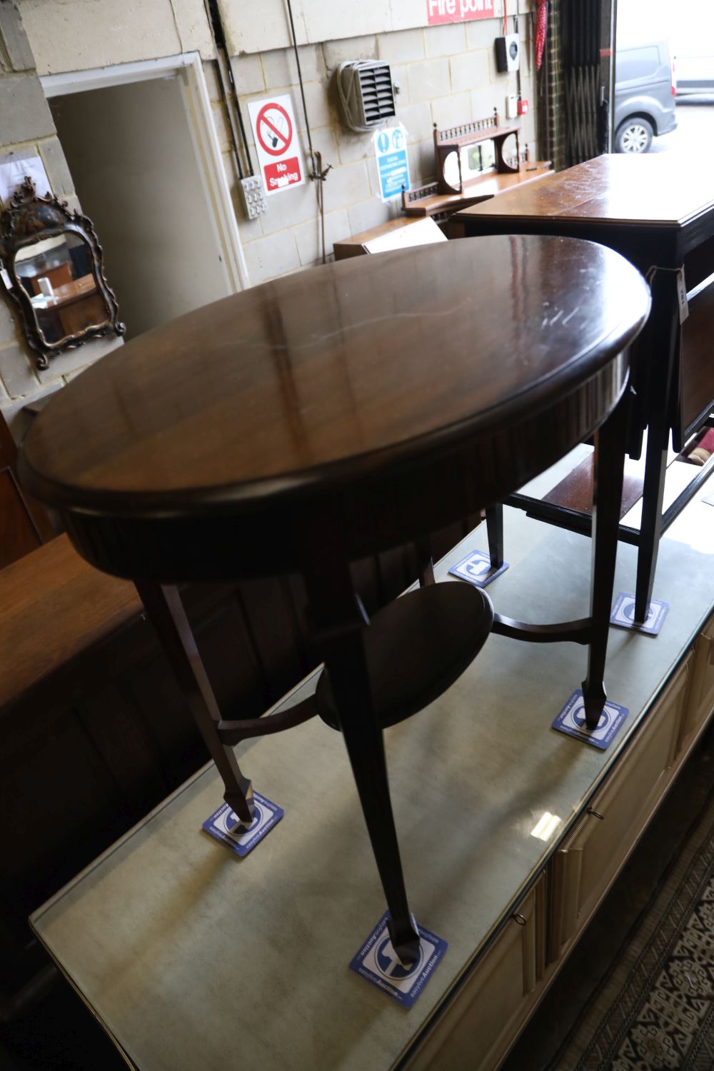 A late Victorian aesthetic movement drop-flap occasional table and a later oval occasional table, larger width 70cm, depth 50cm, height